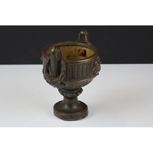 179 - Group of mixed collectables to include a bronze twin-handled urn with floral embellishments, 13cm hi... 