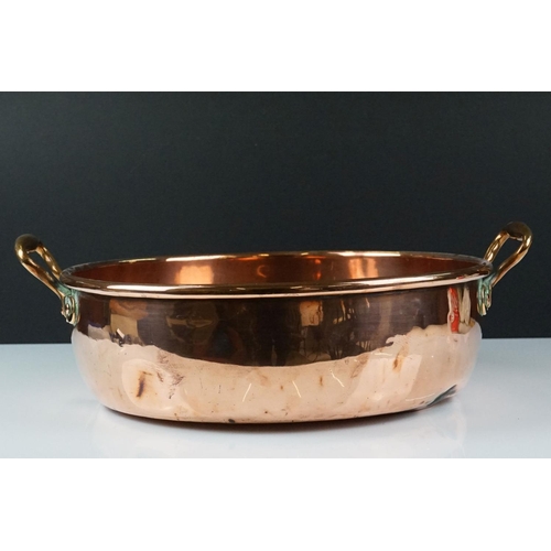 185 - Antique Copper Twin Handled Cooking / Jam Pan, 36cm diameter together with an Antique Copper Skillet... 