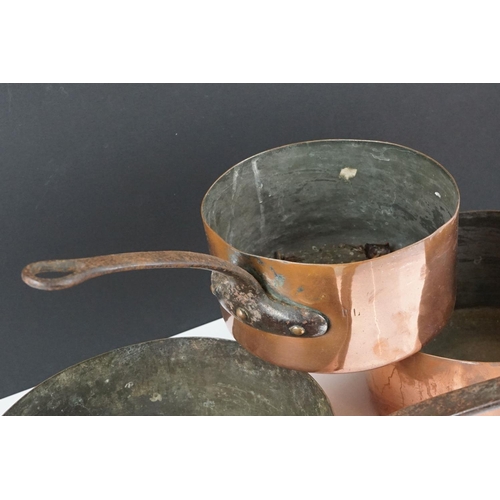 186 - Pair of Copper Graduating Saucepans with Iron Handles, stamped to side P.L., together with a similar... 