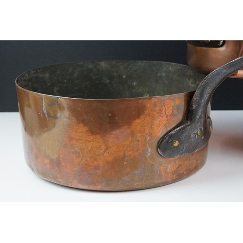 186 - Pair of Copper Graduating Saucepans with Iron Handles, stamped to side P.L., together with a similar... 