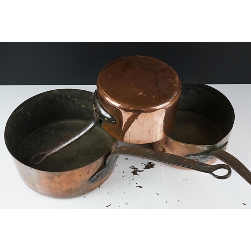 186 - Pair of Copper Graduating Saucepans with Iron Handles, stamped to side P.L., together with a similar... 