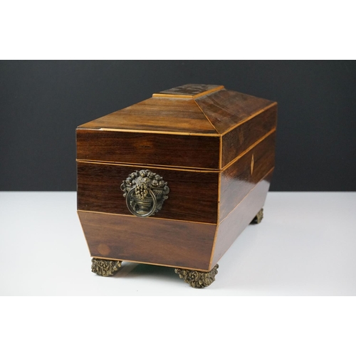 188 - Early 19th century rosewood veneered & satinwood strung sarcophagus tea caddy, with brass foliate fe... 