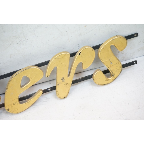 170 - ' Traders ' wooden wall sign mounted on cast iron wall brackets, approx 120cm long