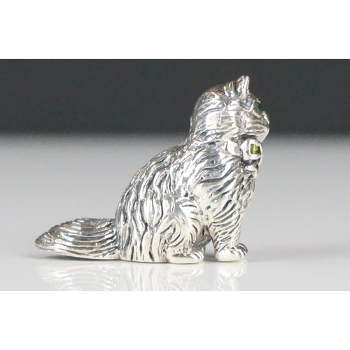 277 - Silver figure of a cat with emerald eyes