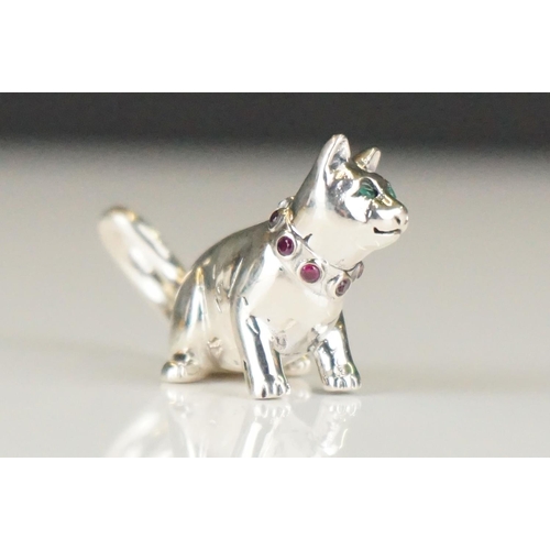 285 - Silver cat figure with ruby collar and emerald eyes