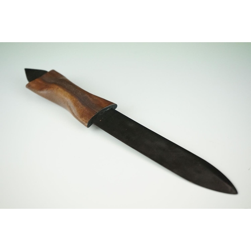 286 - A blackened metal paper knife with formed leather handle.