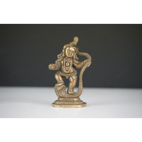 293 - Pair of unusual metal mythical / devil figures, together with a cast metal Indian deity (3)