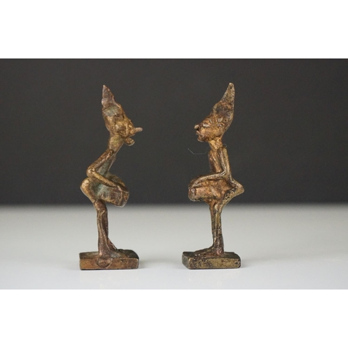 293 - Pair of unusual metal mythical / devil figures, together with a cast metal Indian deity (3)