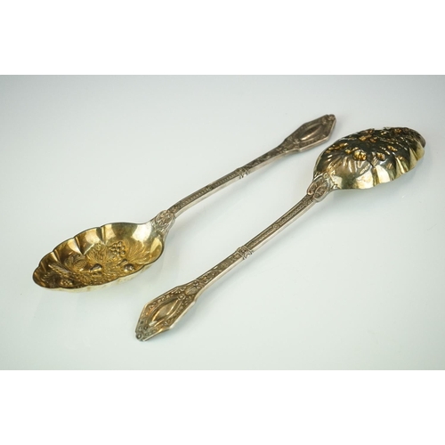 298 - Pair of silver plated berry spoons with gilded bowls