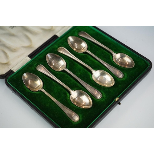 301 - A collection of three cased sets of hallmarked sterling silver teaspoons.