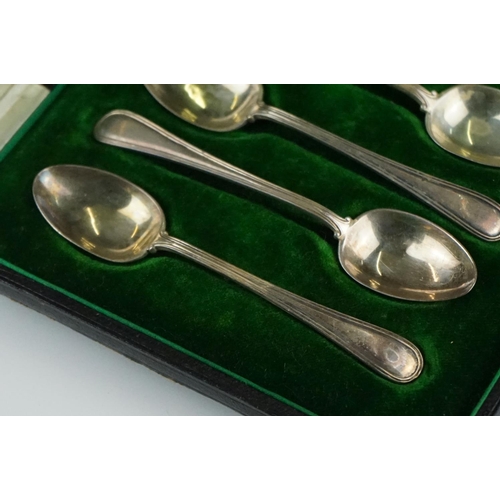 301 - A collection of three cased sets of hallmarked sterling silver teaspoons.