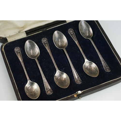 301 - A collection of three cased sets of hallmarked sterling silver teaspoons.