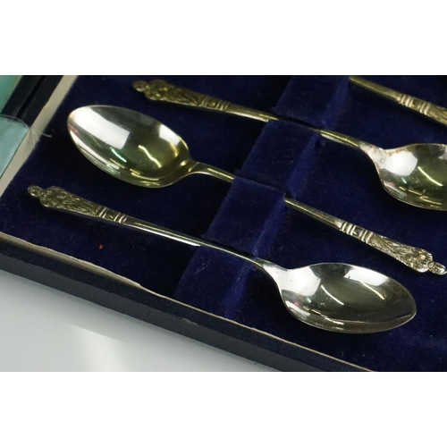 301 - A collection of three cased sets of hallmarked sterling silver teaspoons.