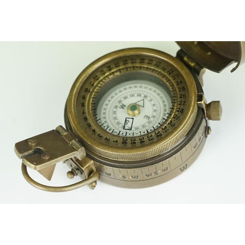 302 - Brass cased military style sundial and compass