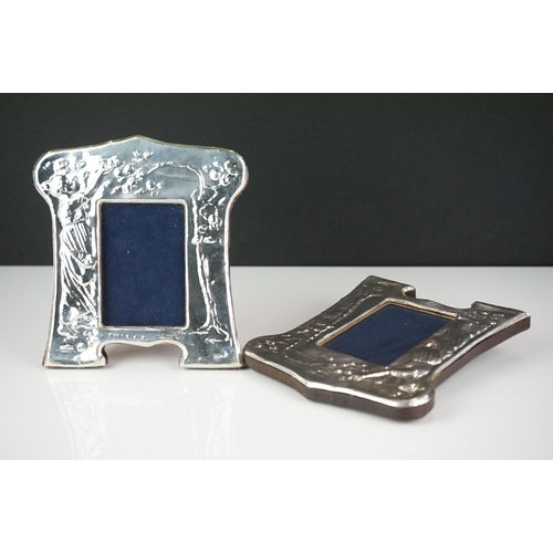 305 - Matching pair of silver photo frames with embossed decoration