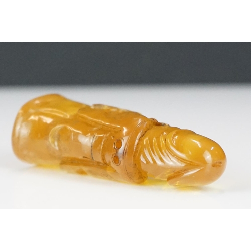 308 - A carved amber Japanese Netsuke pendant in the form of a phallus