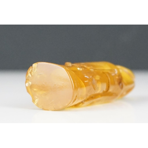 308 - A carved amber Japanese Netsuke pendant in the form of a phallus