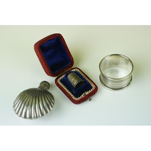 311 - A small collection of hallmarked sterling silver collectables to include candlesticks, napkin ring, ... 