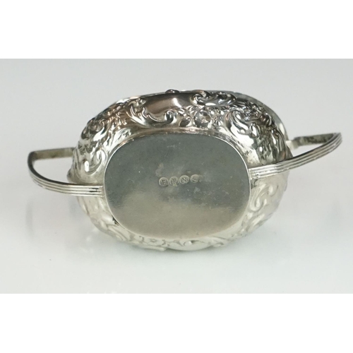 311 - A small collection of hallmarked sterling silver collectables to include candlesticks, napkin ring, ... 