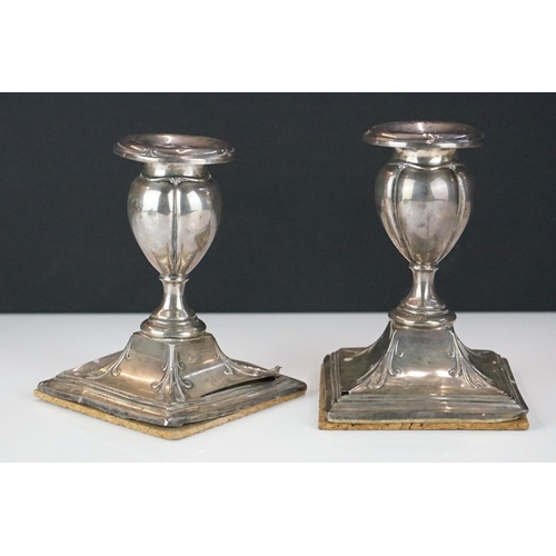 311 - A small collection of hallmarked sterling silver collectables to include candlesticks, napkin ring, ... 