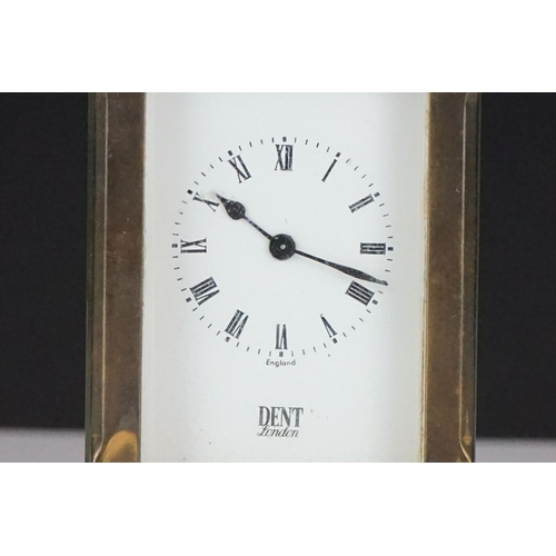 194 - A miniature brass cased carriage clock with beveled glass panels, marked Dent Of London.