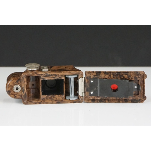 204 - A Vintage Bakelite Coronet Midget camera complete with case.