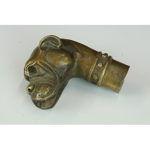 211 - Two brass walking stick handles to include a skull and a bulldog example.