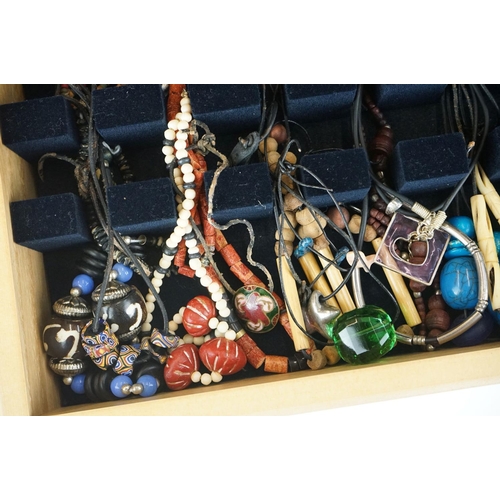 326 - A large collection of mixed costume jewellery to include ethnic and tribal jewellery together with s... 