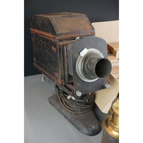 332 - An antique magic lantern slide viewer together with a large quantity of glass slides to include peop... 