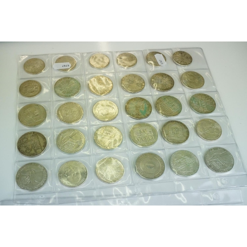 333 - A mixed collection of coins to include commemorative crowns together with a set of photomontage  pos... 