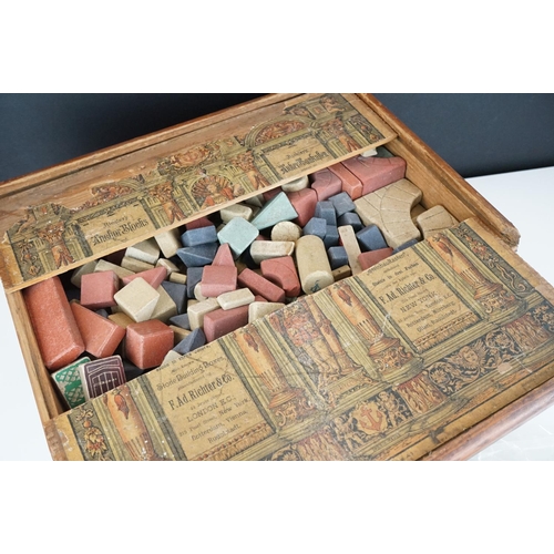 334 - A collection of three antique building block sets, all in original boxes with graphics to lids, incl... 