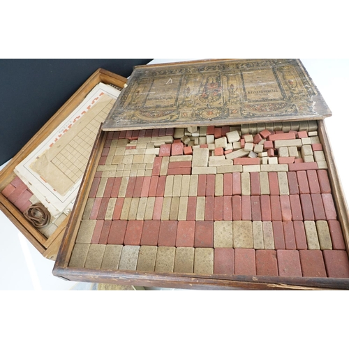 334 - A collection of three antique building block sets, all in original boxes with graphics to lids, incl... 