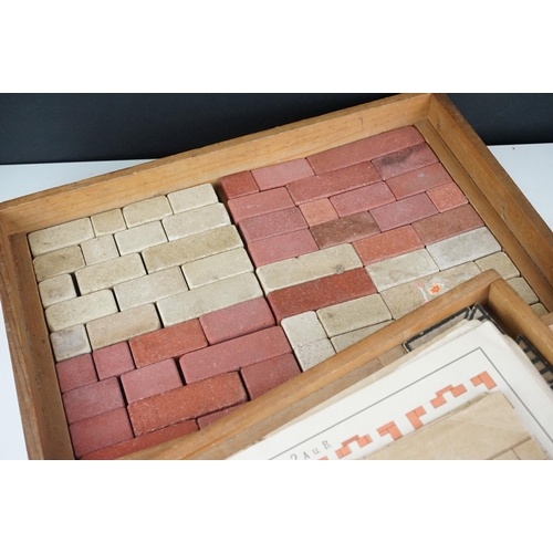 334 - A collection of three antique building block sets, all in original boxes with graphics to lids, incl... 