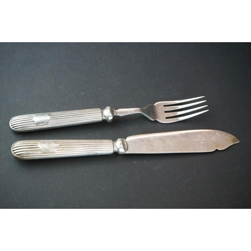 354 - A silver plated fish knife and fork set.