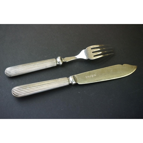 354 - A silver plated fish knife and fork set.