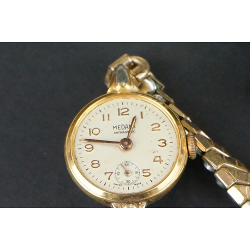 355 - A small collection of ladies and gents vintage wristwatches to include a 9ct gold cased example.