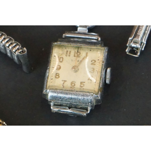 355 - A small collection of ladies and gents vintage wristwatches to include a 9ct gold cased example.