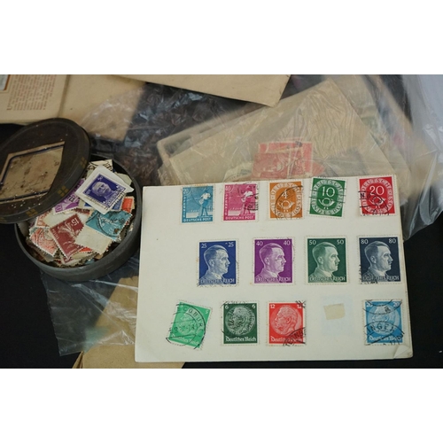 362 - A small collection of stamps and cigarette cards.