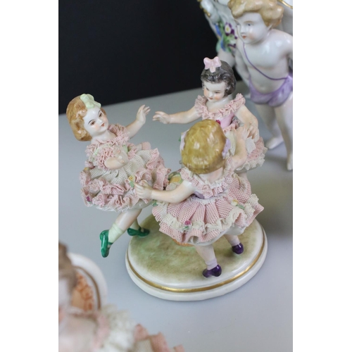 103 - Von Schierholz porcelain figural compote centre-piece raised on four feet, modelled as putti, with f... 