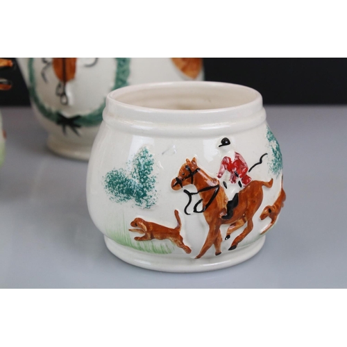 107 - PPC Hunting themed teapot & cover, sugar bowl and milk jug, decorated with relief decoration depicti... 