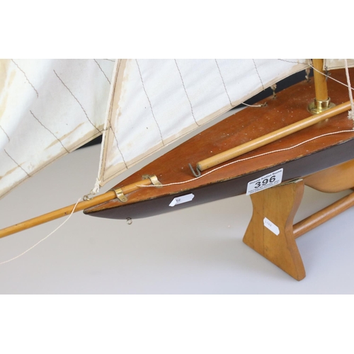 396 - Wooden Pond Yacht on stand, 64cm long