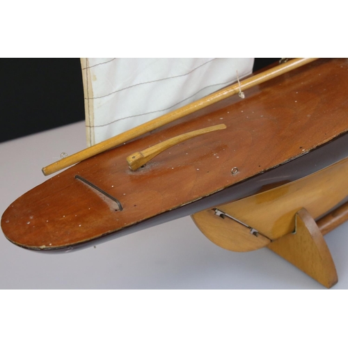 396 - Wooden Pond Yacht on stand, 64cm long