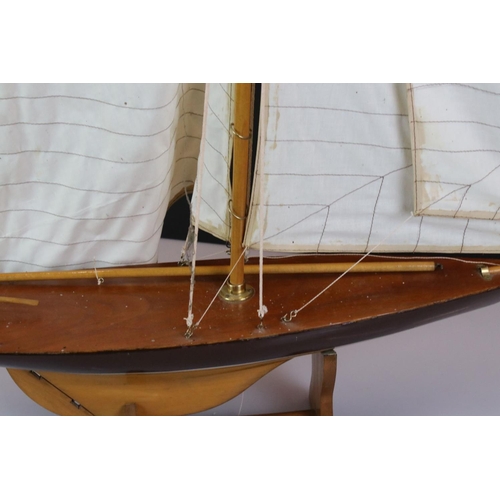 396 - Wooden Pond Yacht on stand, 64cm long