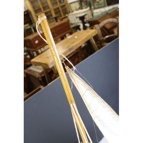 396 - Wooden Pond Yacht on stand, 64cm long