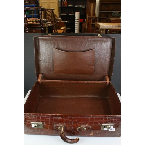 428 - Early 20th century Crocodile Skin Suitcase with applied luggage label, 70cm long x 22cm high