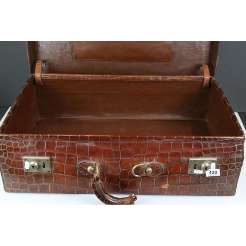 428 - Early 20th century Crocodile Skin Suitcase with applied luggage label, 70cm long x 22cm high