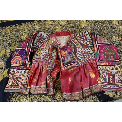 443 - Indian Embroidered Child's Jacket together with Four Islamic / Ottoman Embroidered Cloths / Panels a... 