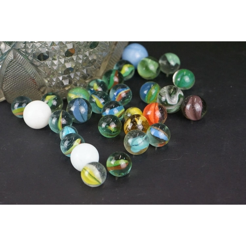 371 - A large collection of mainly contemporary marbles contained within a glass jar.