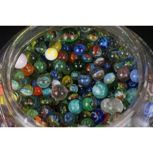 371 - A large collection of mainly contemporary marbles contained within a glass jar.