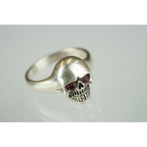 216A - A small collection of contemporary silver jewellery to include a coffin necklace, skull ring and Spi... 